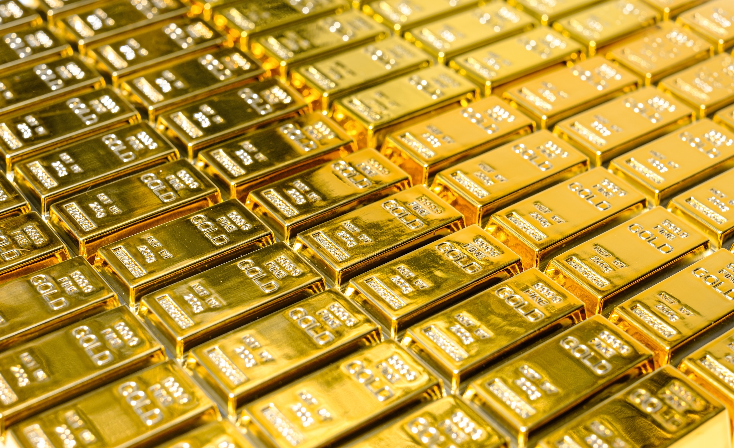 Rows of gleaming gold bars symbolising wealth and security, illustrating the topic of gold investing myths and the reality behind gold as an investment.
